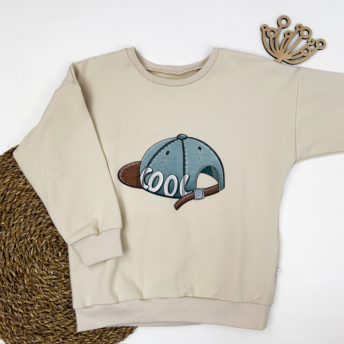 Kinder Oversize-Pullover mit Cap-Print aus Baumwolle – Creme
