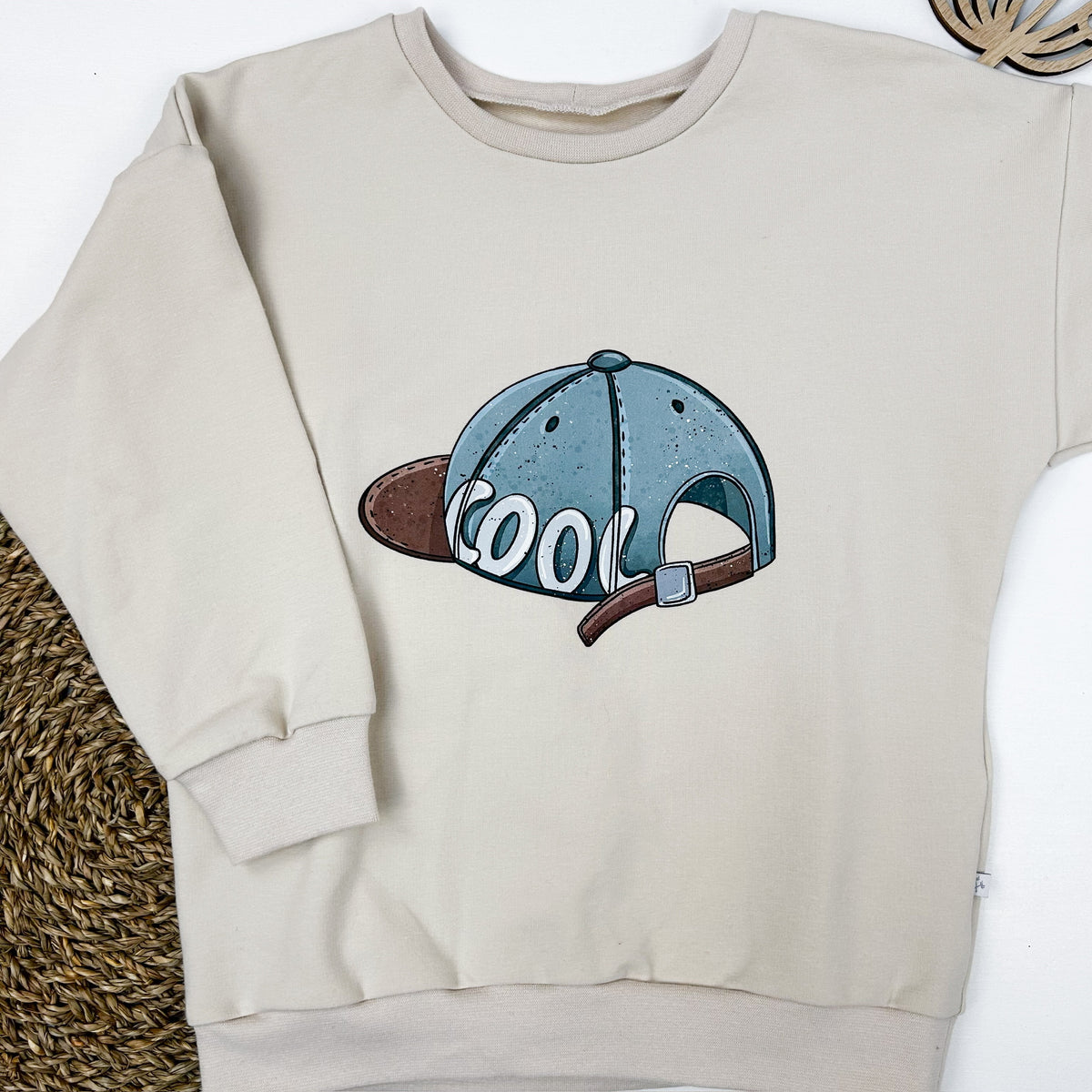 Kinder Oversize-Pullover mit Cap-Print aus Baumwolle – Creme