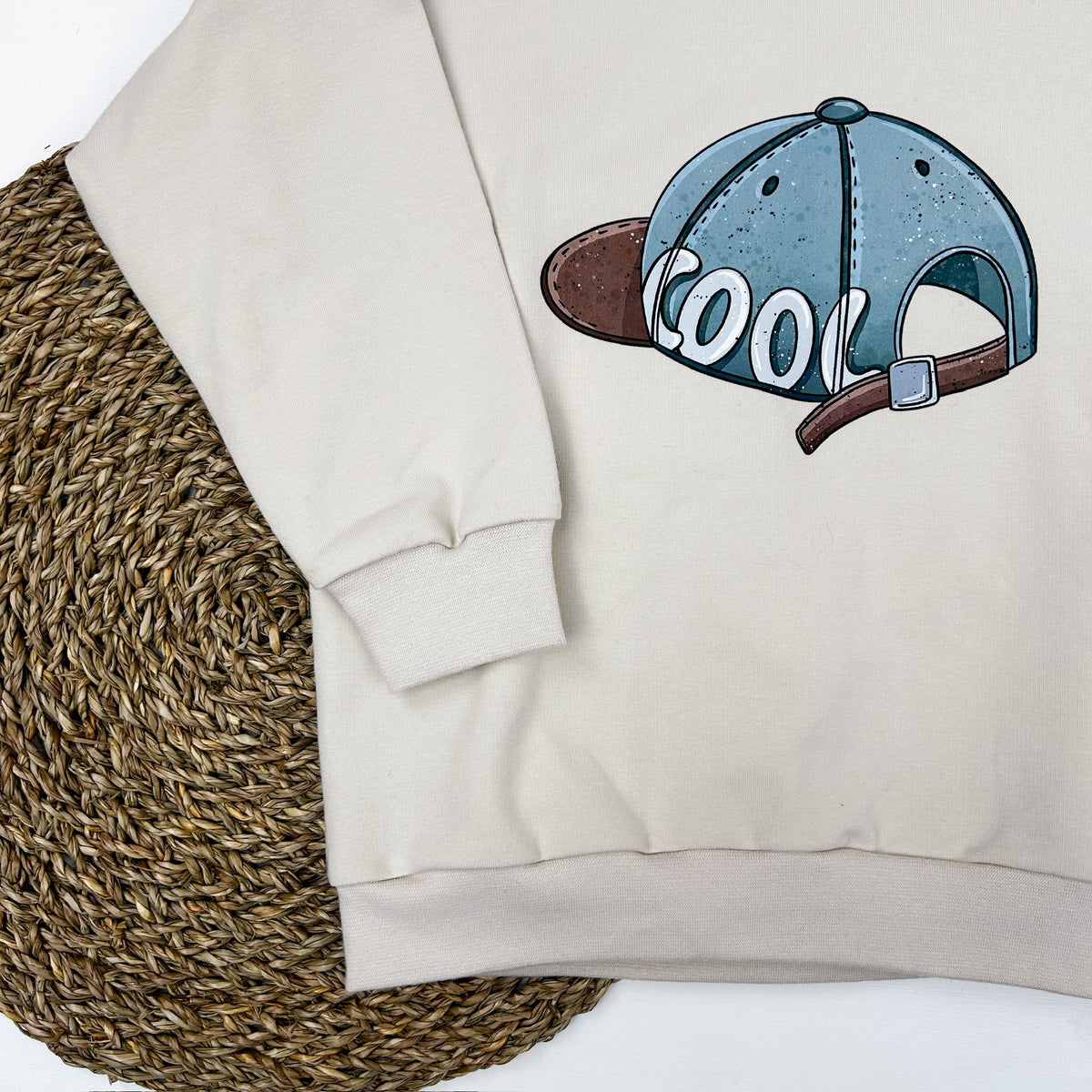 Kinder Oversize-Pullover mit Cap-Print aus Baumwolle – Creme